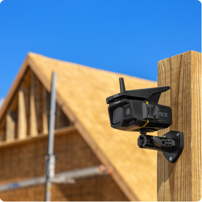 VKX camera mounted on a wood post at a home under construction